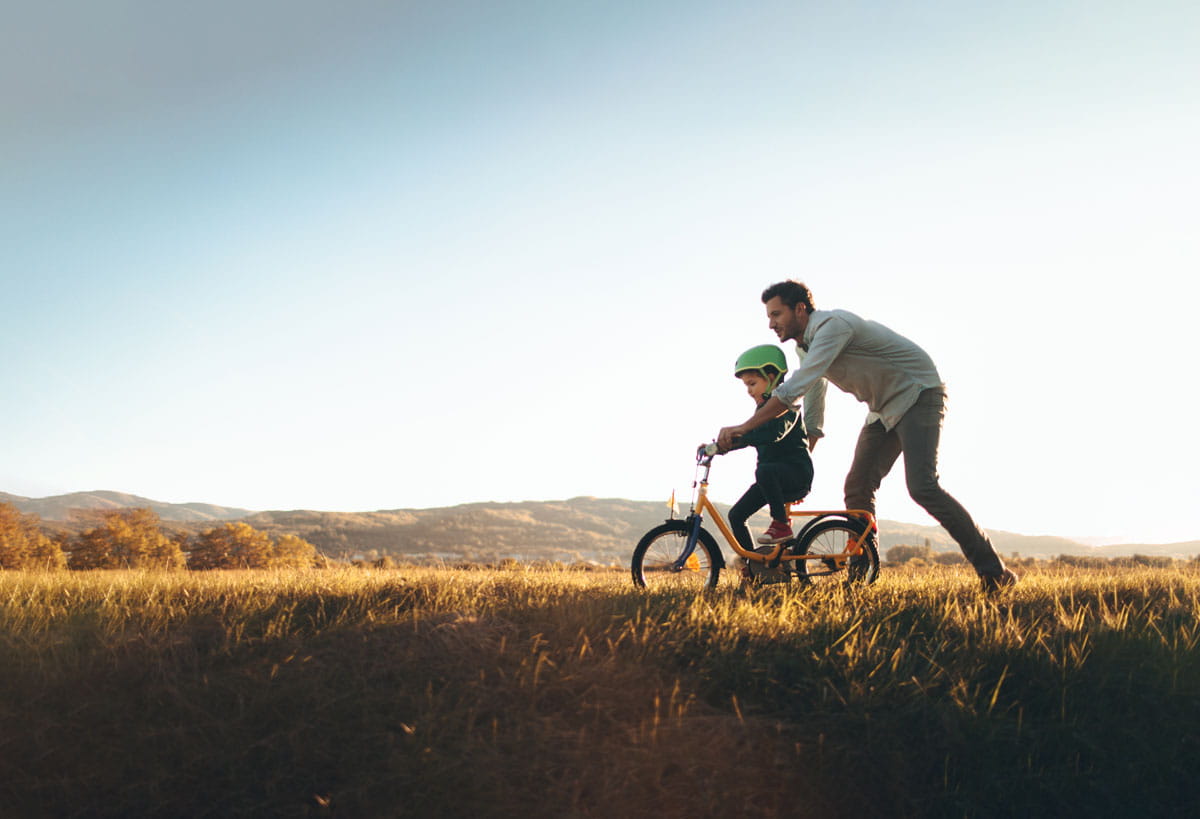 Man and son on bike