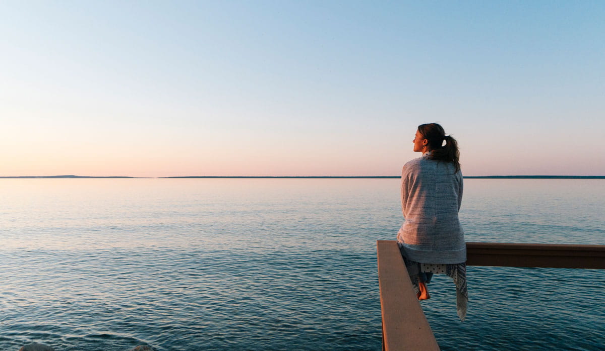 Woman looking out at the water