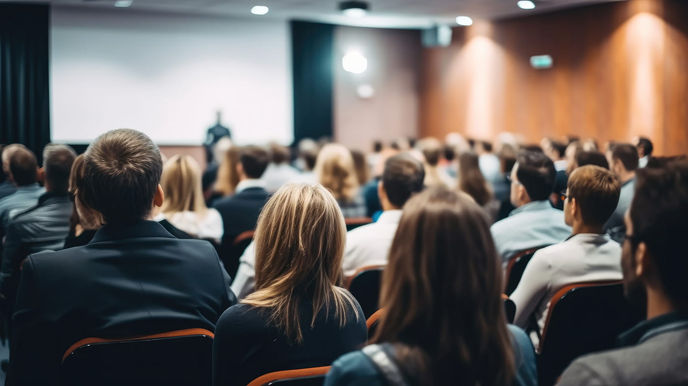 Audience members at meeting